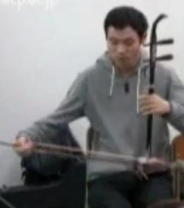 Man playing an instrument