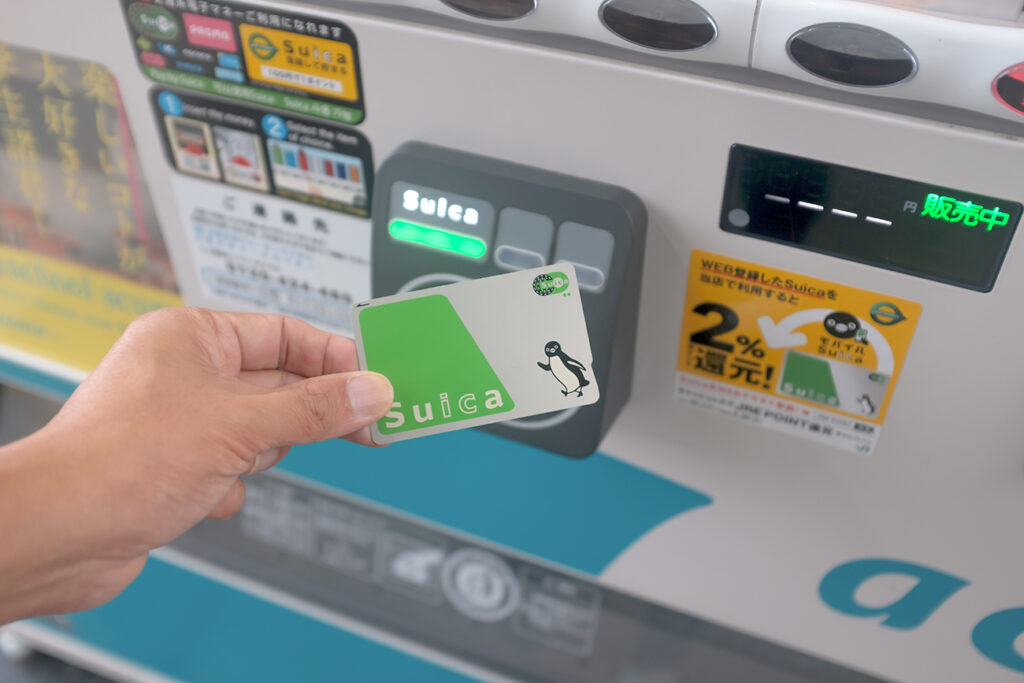 Hokkaido, Japan - October 29, 2019 : Close up view of a customer using a Suica prepaid e-money card to buy drinks from a vending machine at Sapporo Station